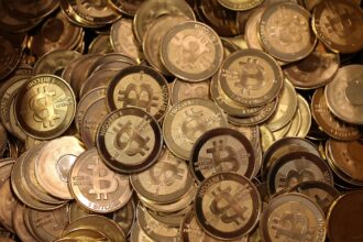 A pile of Bitcoin slugs sit in a box ready to be minted by Software engineer Mike Caldwell in his shop on April 26, 2013 in Sandy, Utah.