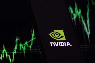 NVIDIA logo with stock market chart in green on dark background