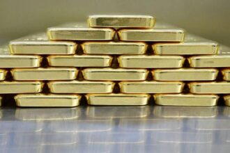 Gold bars stacked in storage