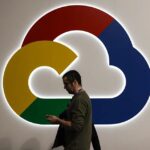 Google Cloud logo on wall with man walking