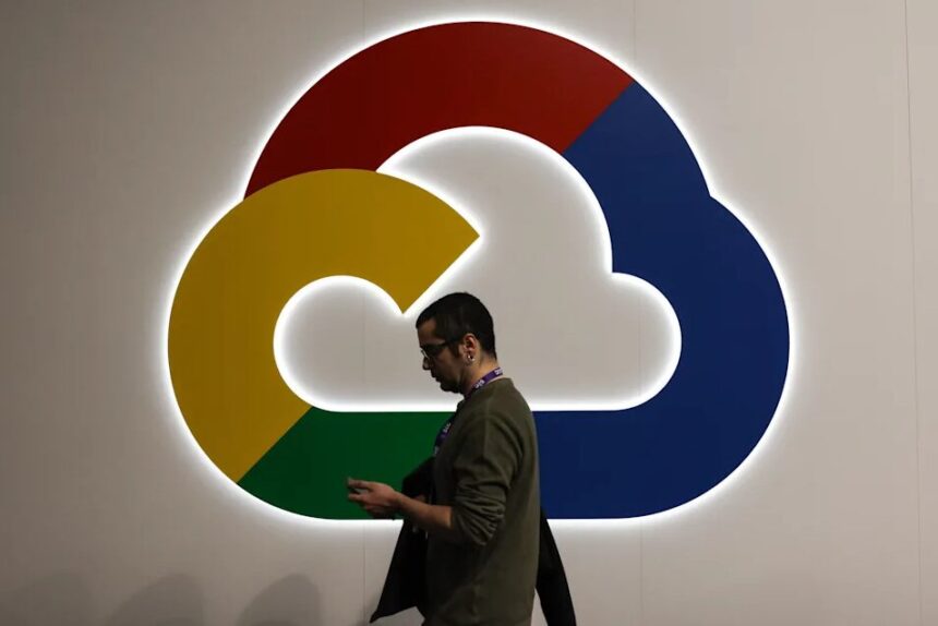 Google Cloud logo on wall with man walking