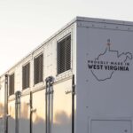 A grid-scale battery stands against a clear sky.