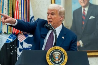 Trump speaking at White House podium about tariffs