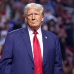 President Trump in blue suit with red tie